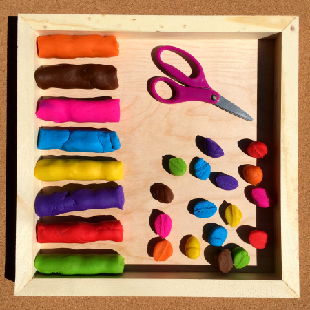 Family FECS: Montessori Activity: Cutting Playdough with Scissors